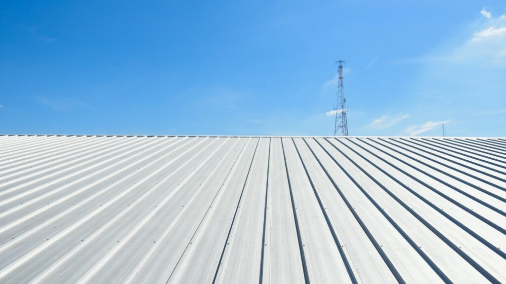 Commercial metal roof under blue sky