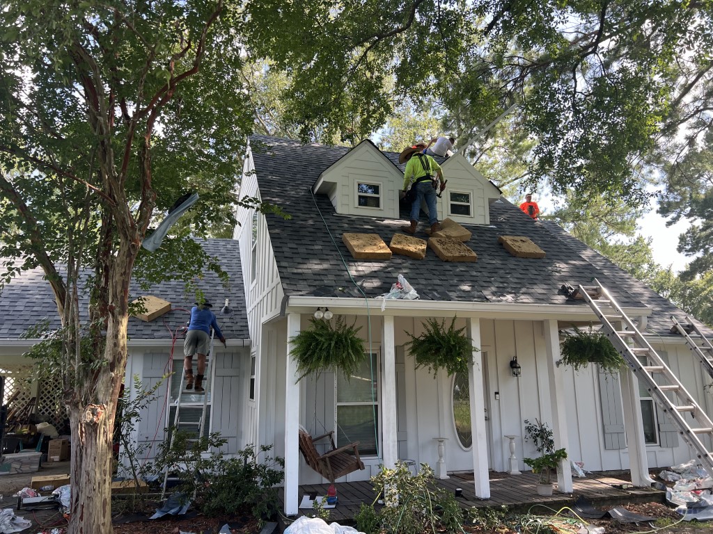 Roof replacement on white home