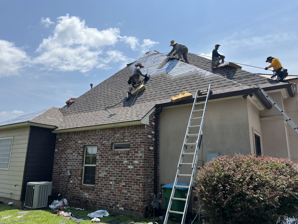 Close-up roof replacement crew