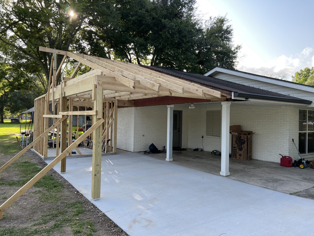 Framed addition beside existing home